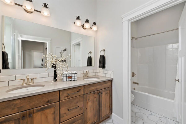 bright bathroom with wood cabinents