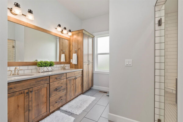 bright bathroom with wood cabinents