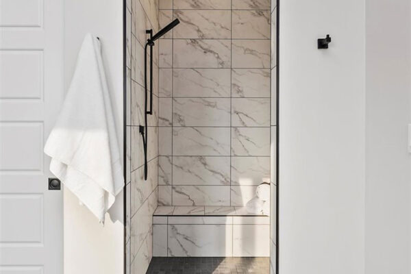 white marble shower in custom home