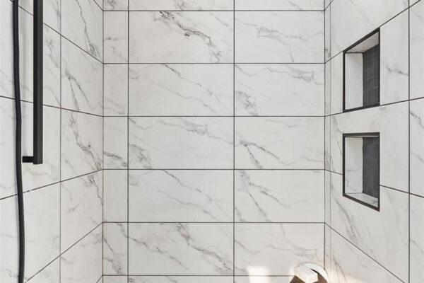 white marble shower in custom home