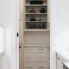 A picture looking into a walk-in pantry, displaying one of the features that can be implemented into designing a custom dream home.