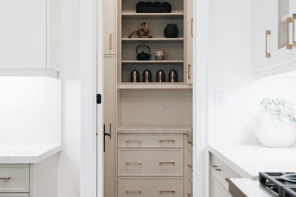 A picture looking into a walk-in pantry, displaying one of the features that can be implemented into designing a custom dream home.