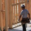 A home builder faces the framing of a custom home build.